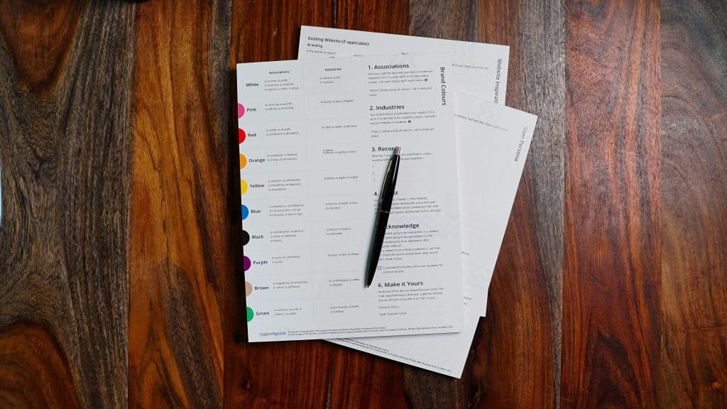 Papers on a wooden desk